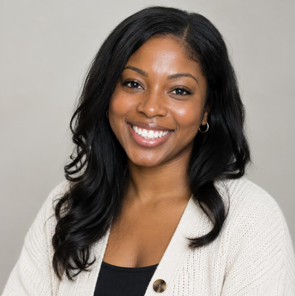 Portrait of a young woman with dark hair smiling